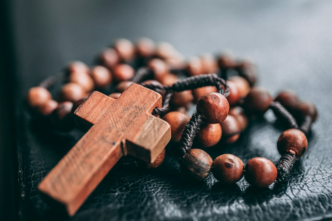 A rosary representing the spiritual work of mercy to pray for the living and the dead.
